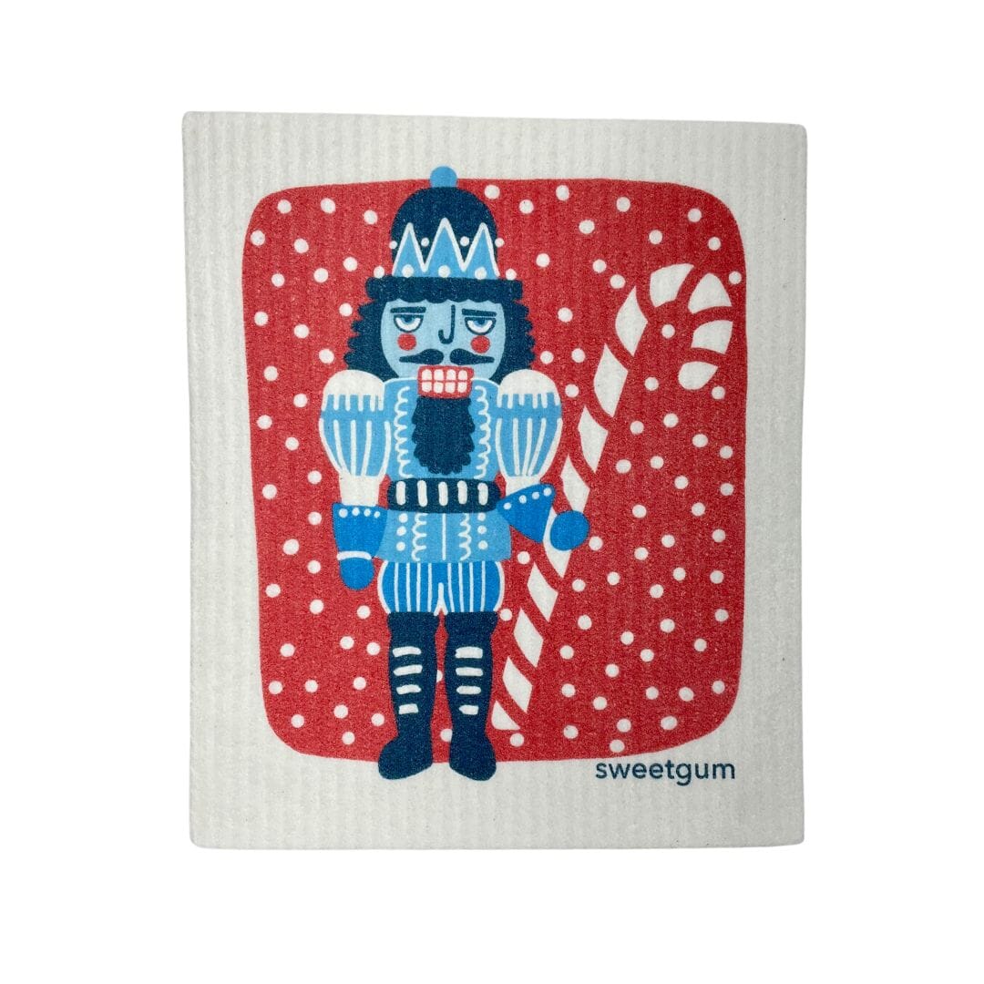Blue Nutcracker Swedish Dishcloth | Red background with snow Swedish Dishcloths sweetgum textiles company, LLC 